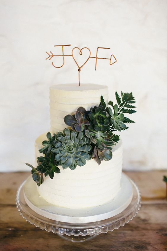 wedding cake with succulent and copper opper