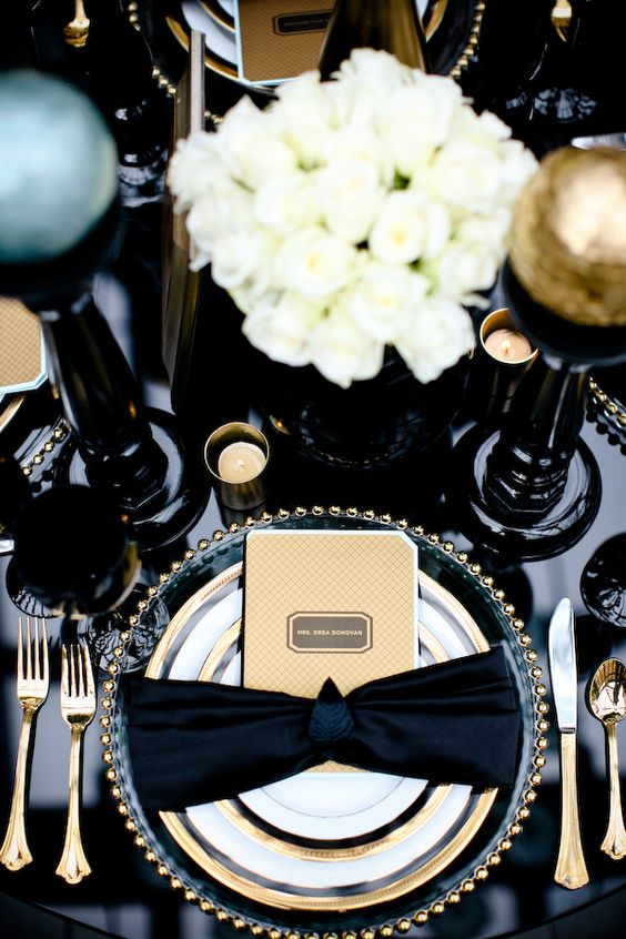 Black, white, and gold table setting