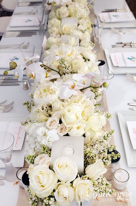 Elegant white flower wedding reception centerpiece