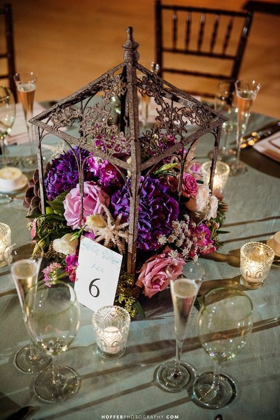 Rustic iron terrarium lantern centerpieces with antique votives