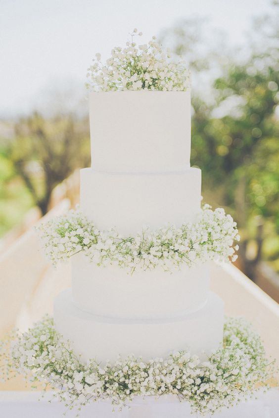 White 4 Tier Wedding Cake decorated with Gypsophila