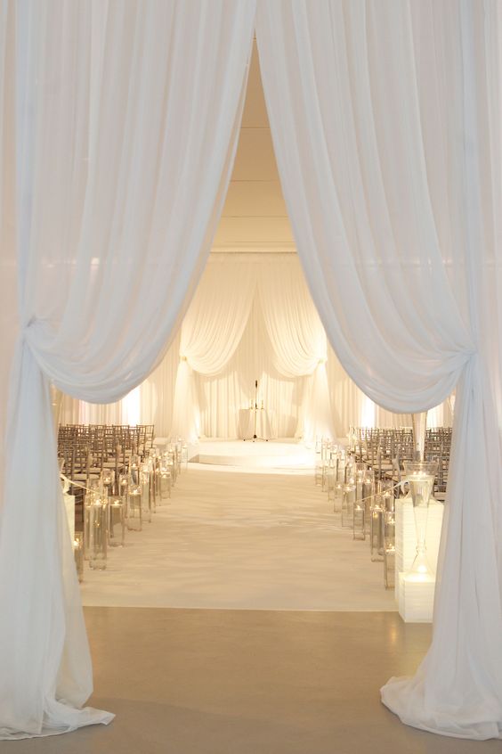 White drapery at indoor wedding ceremony