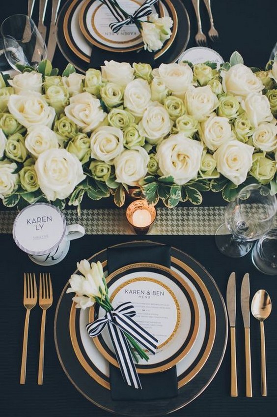 black white and gold place setting for a wedding reception