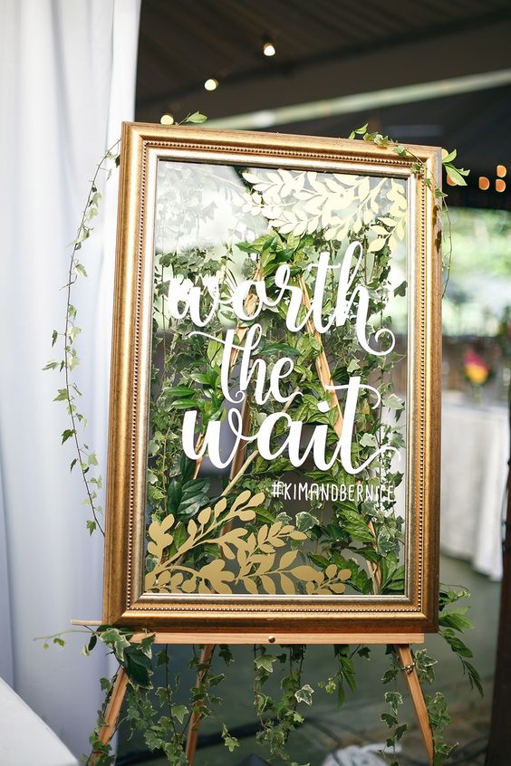 gold frames and greenery welcome wedding sign