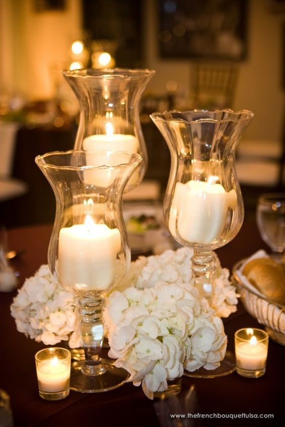 inexpensive centerpiece with low florals and tall candle vase
