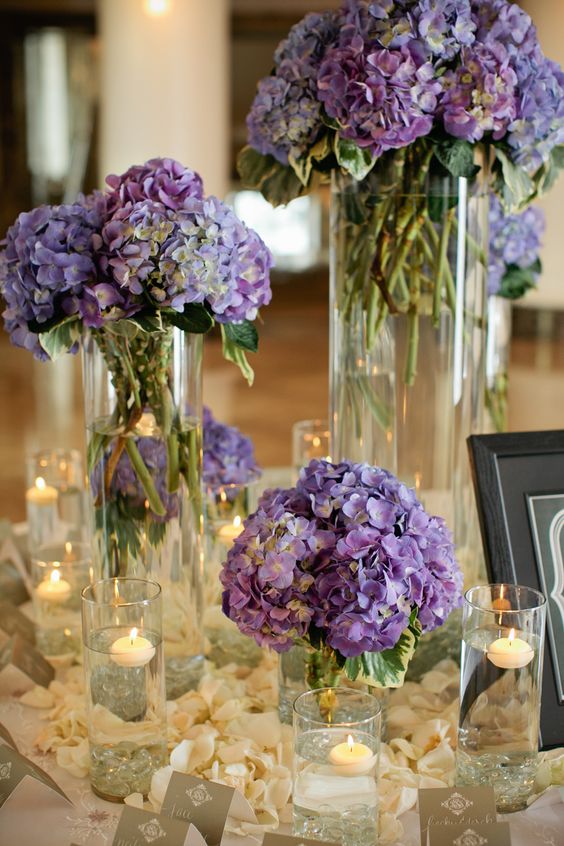 purple hydrangea centerpieces combined with candles and flower petals