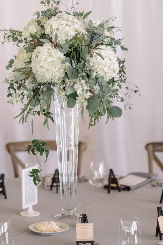 white and green tall wedding centerpieces