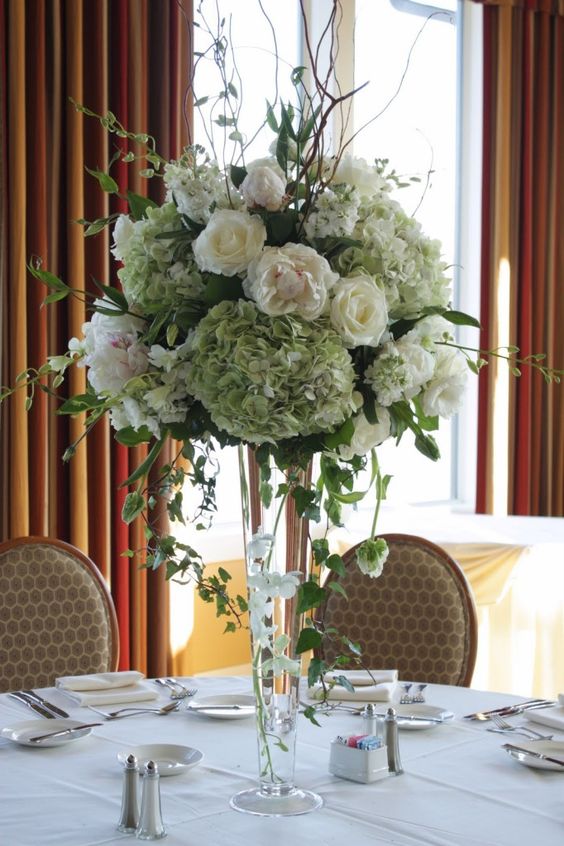 white and greenery tall wedding centerpiece