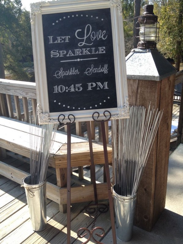 rustic country outdoor wedding sparkler display with vintage sign
