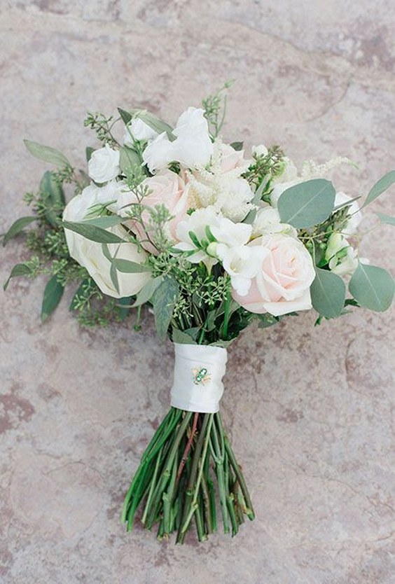 roses ranunculus hydrangea and eucalyptus wedding bouquet