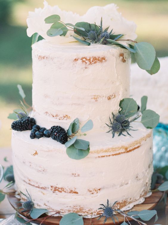 rustic naked wedding cake with eucalyptus