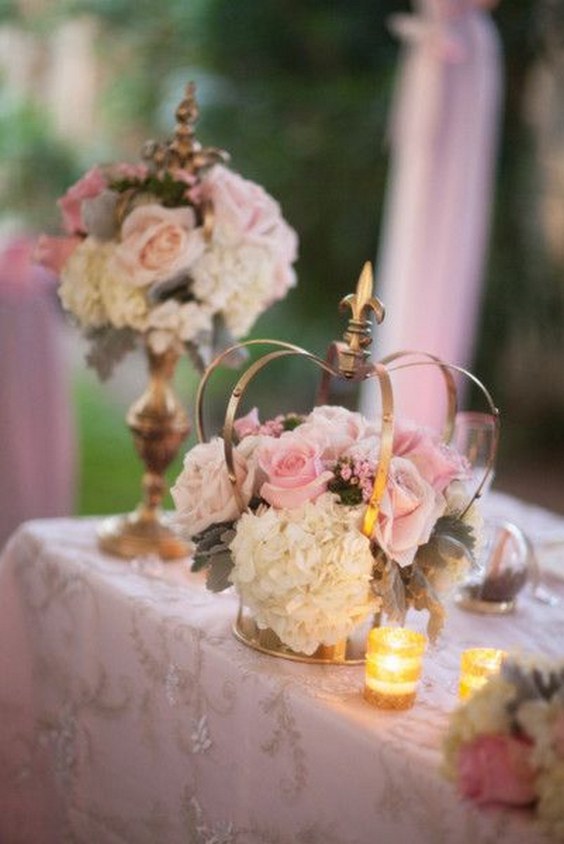 gold crowns and pink centerpieces for a garden wedding