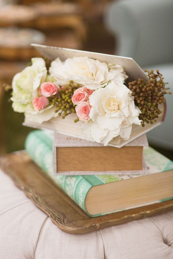 vintage books and flowers wedding centerpiece