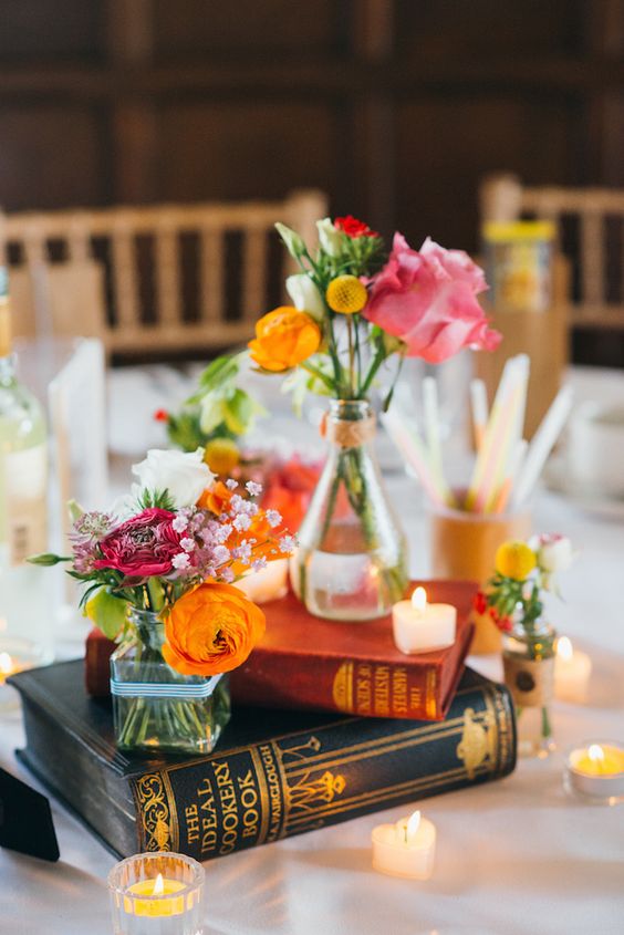 vintage flowers and books wedding centerpiece