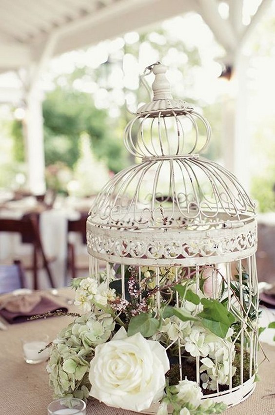 vintage ivory birdcage and flowers wedding centerpiece