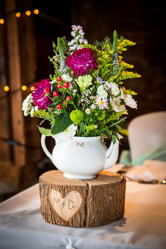 vintage teapot and tree stump wedding centerpiece