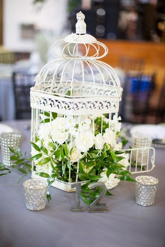 vintage white and greenery birdcage wedding centerpiece