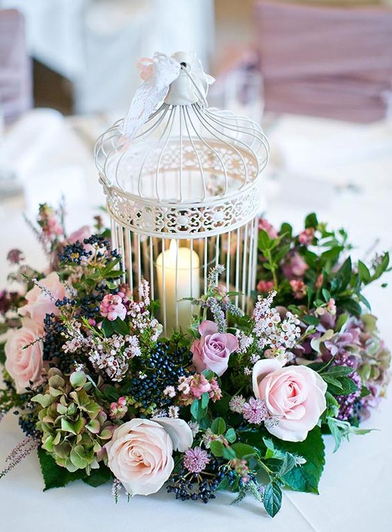 vintage white birdcage and flowers wedding centerpiece