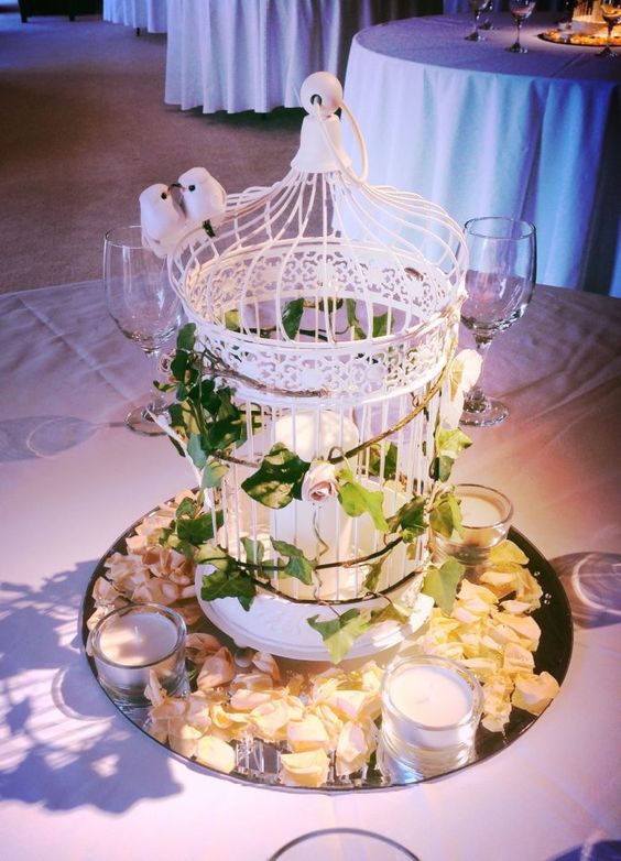 vintage white birdcage and greenery wedding centerpiece