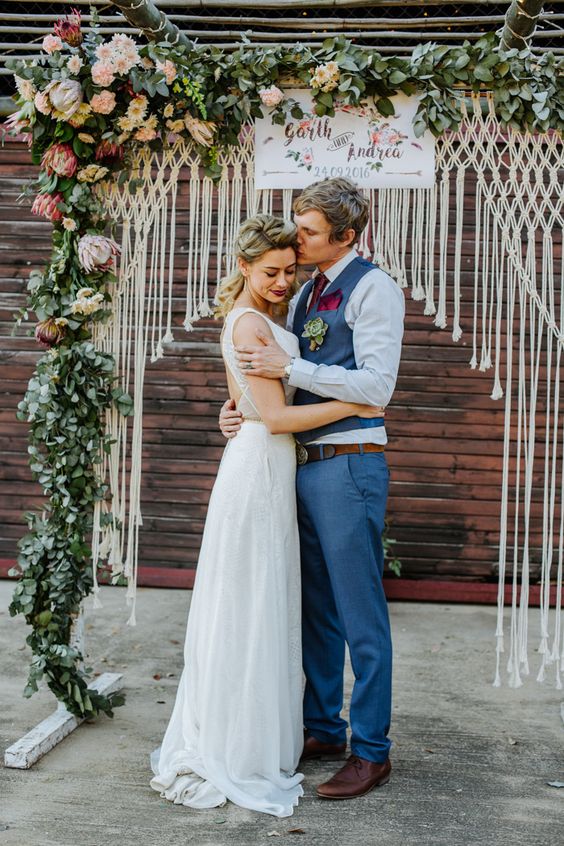 DIY macrame and floral wedding ceremony arch
