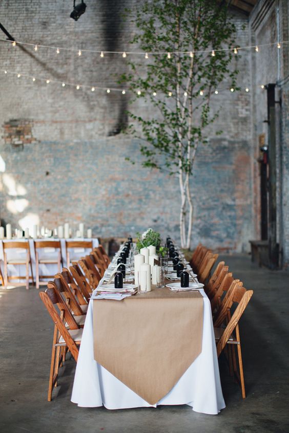 Industrial reception ideas brown paper table runner + black glass bottle place settings
