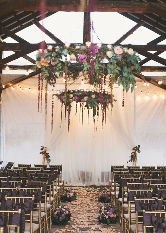 floral chandeliers, ribbon ceremony chairs and floral aisle