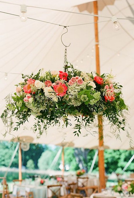 tented reception becomes a garden-inspired bash with the help of these lush floral chandeliers