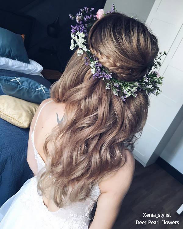 Half up half down wedding guest hairstyles with flower crown