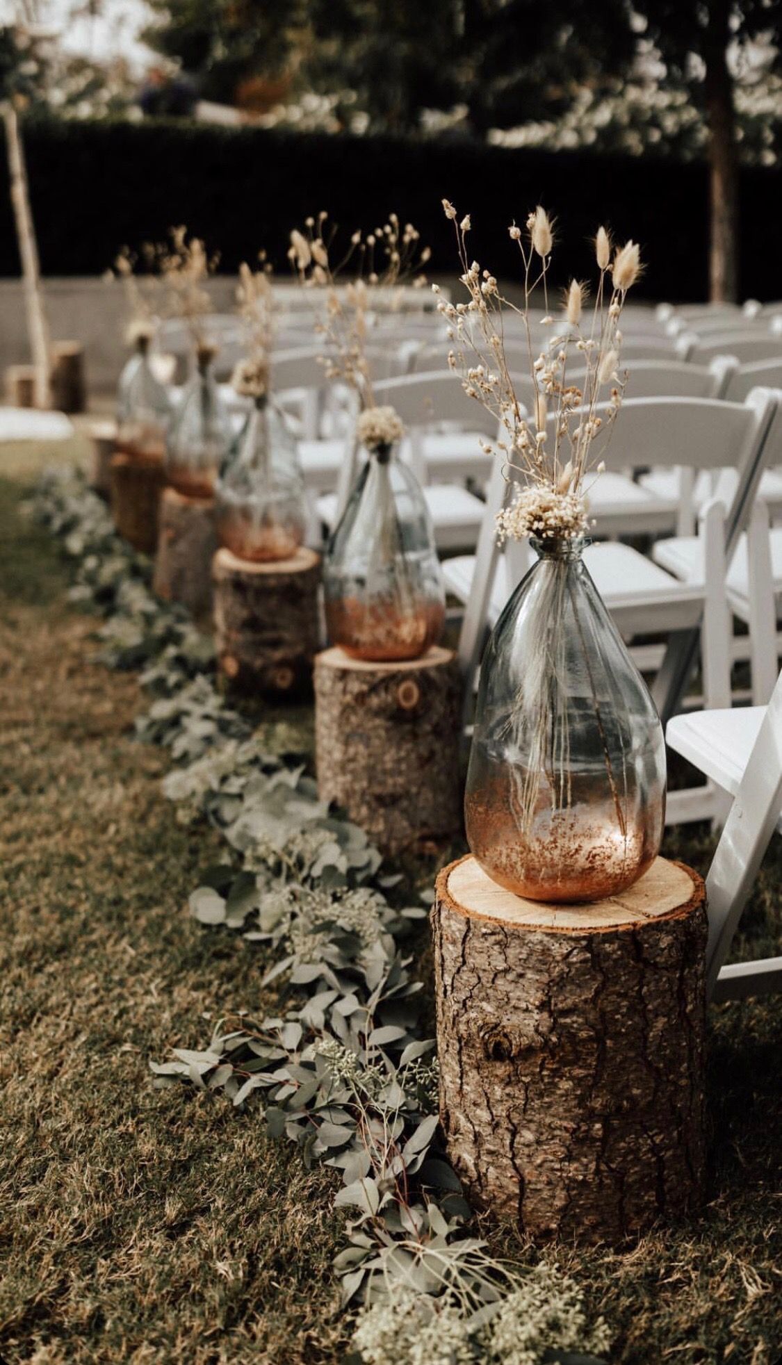 Shabby and chic bottles and greenry ceremony