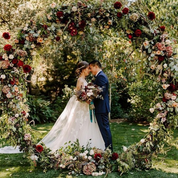 Green and burgundy wedding wreath backdrop 2