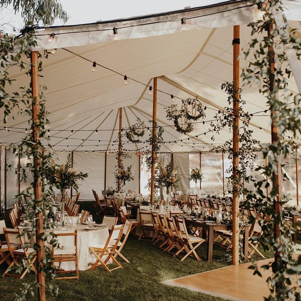 Greenery tented wedding reception decor 1