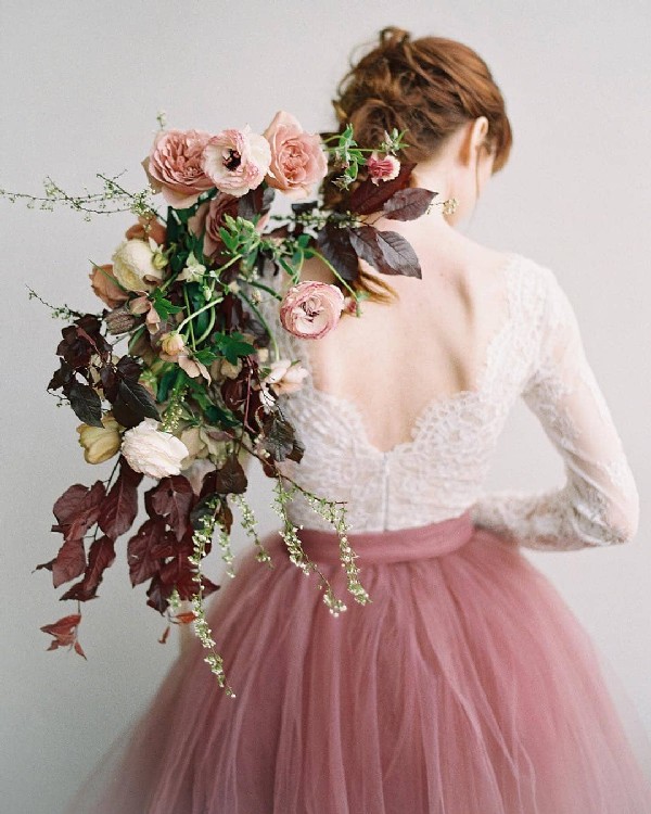 cinnamon rose wedding bouquet and tulle wedding dress