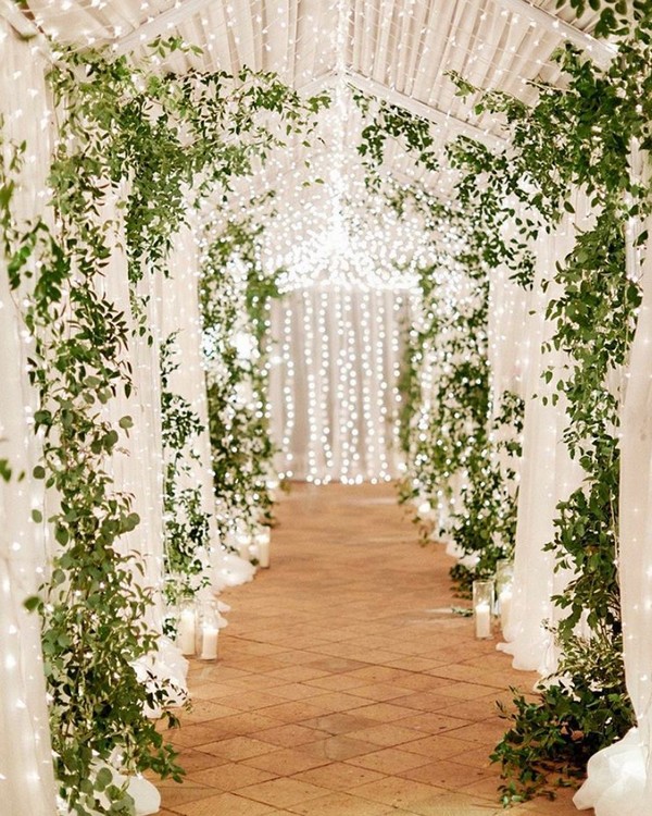 greenery and lighting wedding entrance 11
