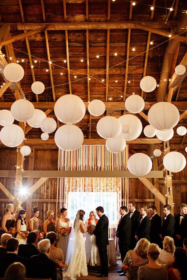paper lanterns and string lights barn wedding decor