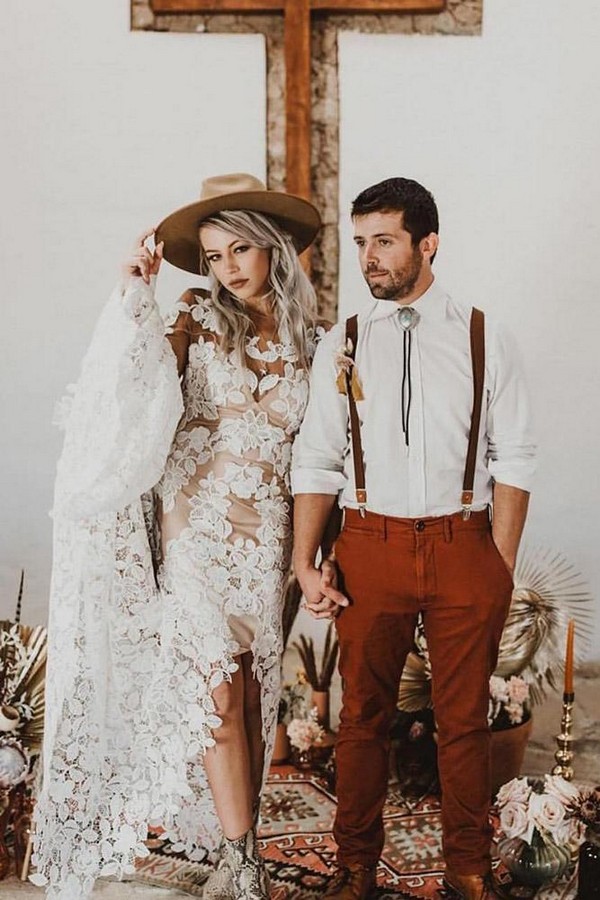 rust wedding color bohemian bridal couple with bride in lace dress and hat 