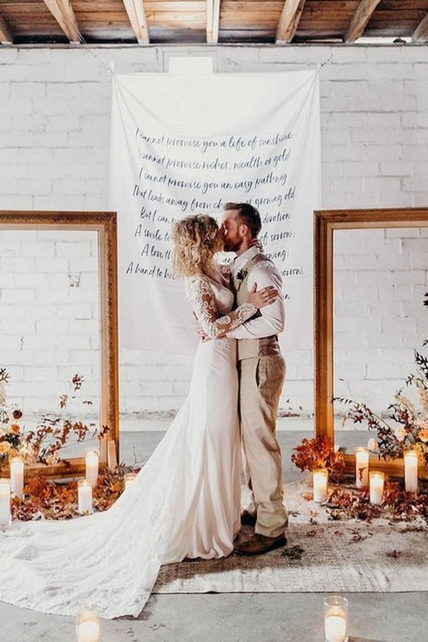rust wedding color ceremony backdrop with frames candles and flowers rachelantigua