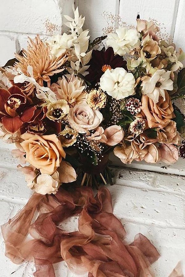 rust wedding color flower bouquet with roses and ribbons