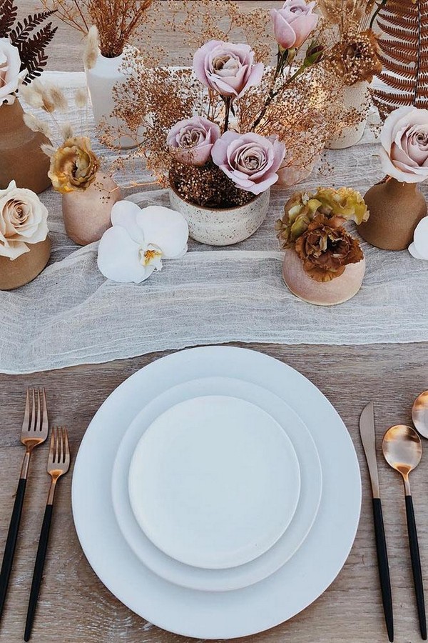 rust wedding color reception table with blush flowers on wooden table bestdayeverfloraldesign