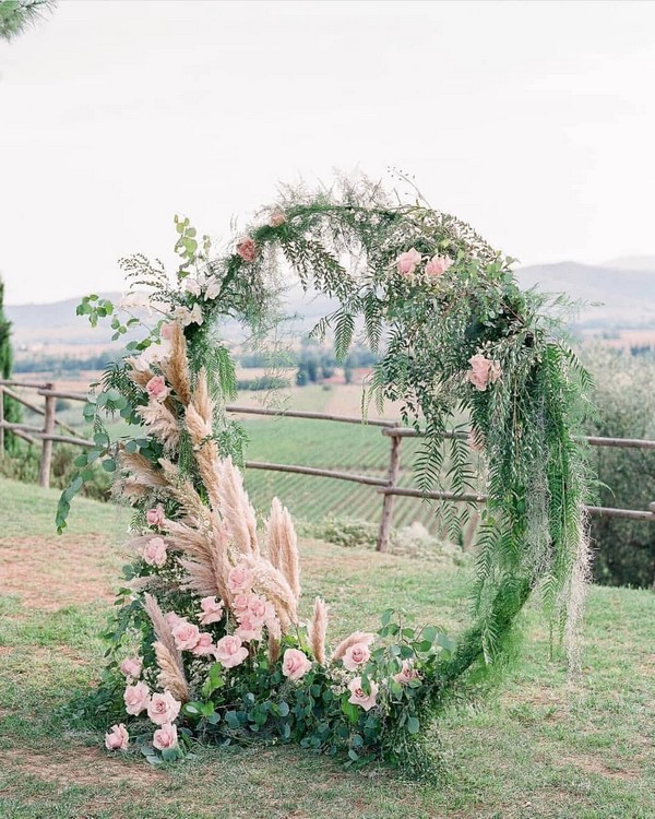 greenery and blush floral wedding arbor