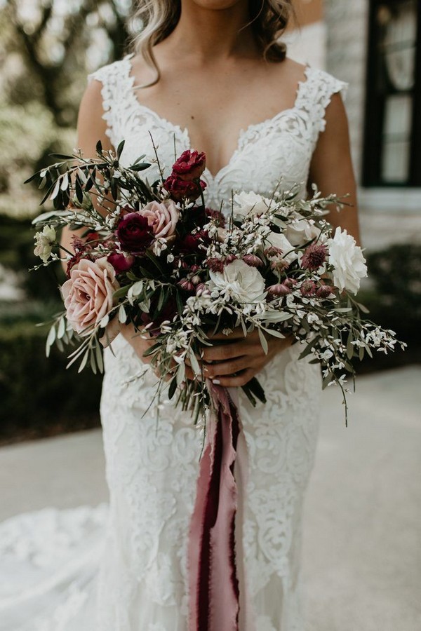 romantic and girly bridal bouquet features blush, wine, and white blooms