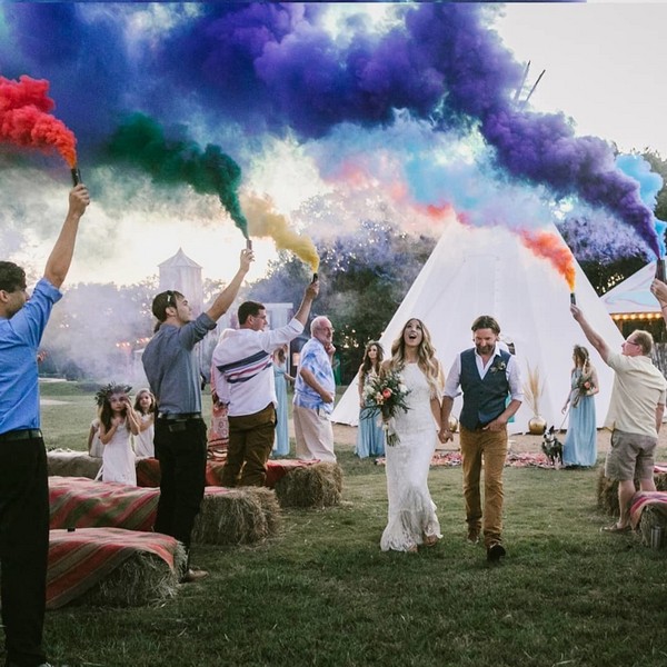 wedding photo with purple green orange smoke bombs