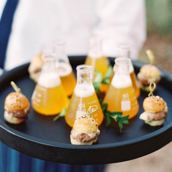 Beer served in beakers pairs perfectly with mini cheeseburger sliders