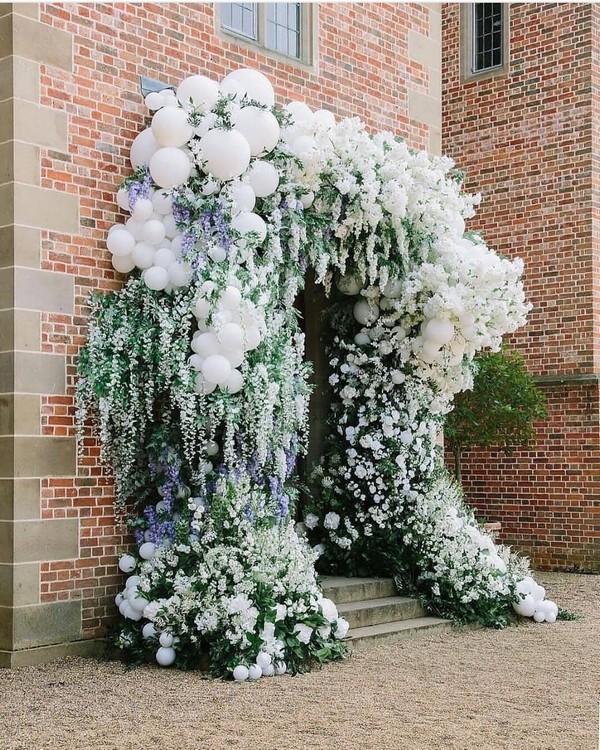 greenery and white balloons wedding entrance 7