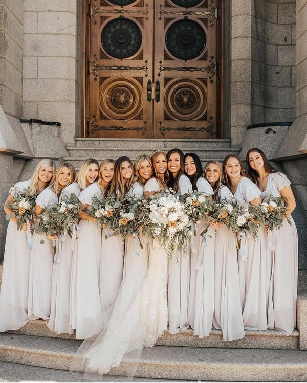 white bridesmaid dresses and greenery wedding bouquets
