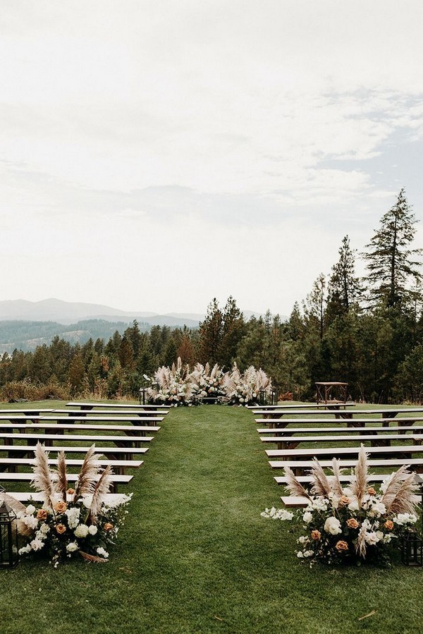 outdoor wedding ceremony with white benches