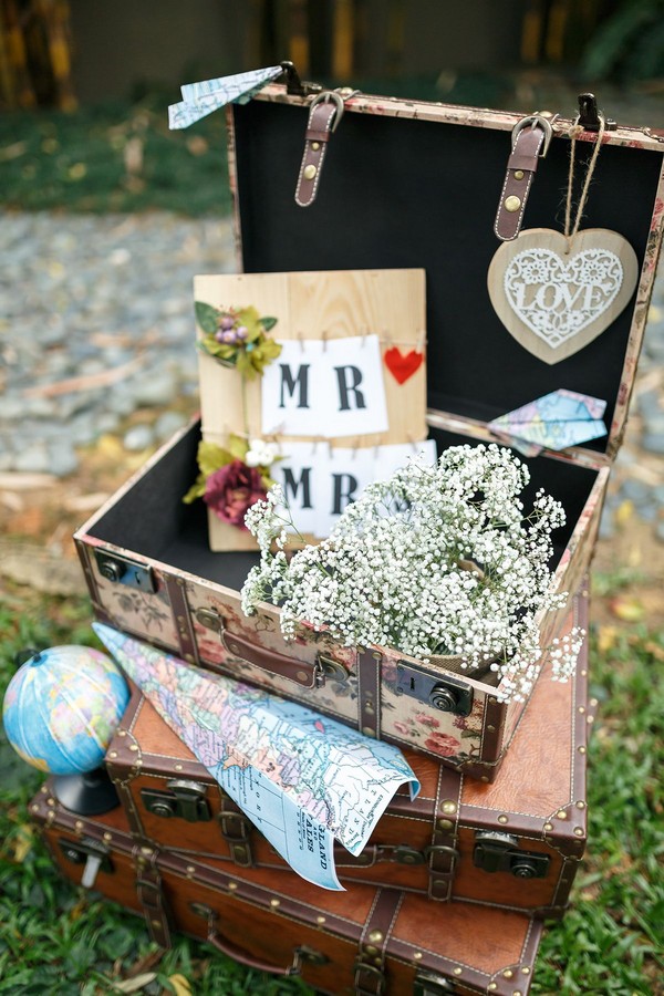 Suitcases, maps and baby's breath rustic travel-inspired wedding
