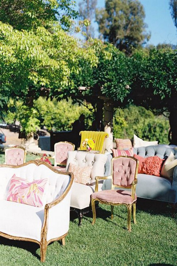 mismatched vintage chairs and love seats in lieu of traditional ceremony seating