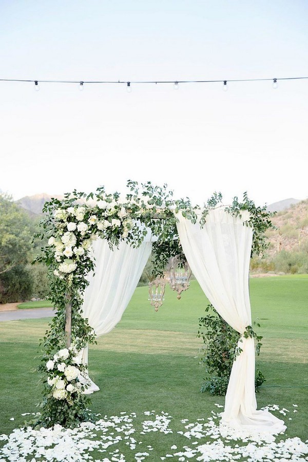 outdoor greenery wedding arch