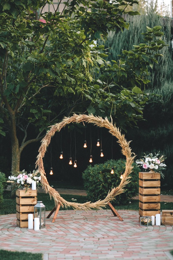 rustic pampas grass and wooden crates wedding backdrop