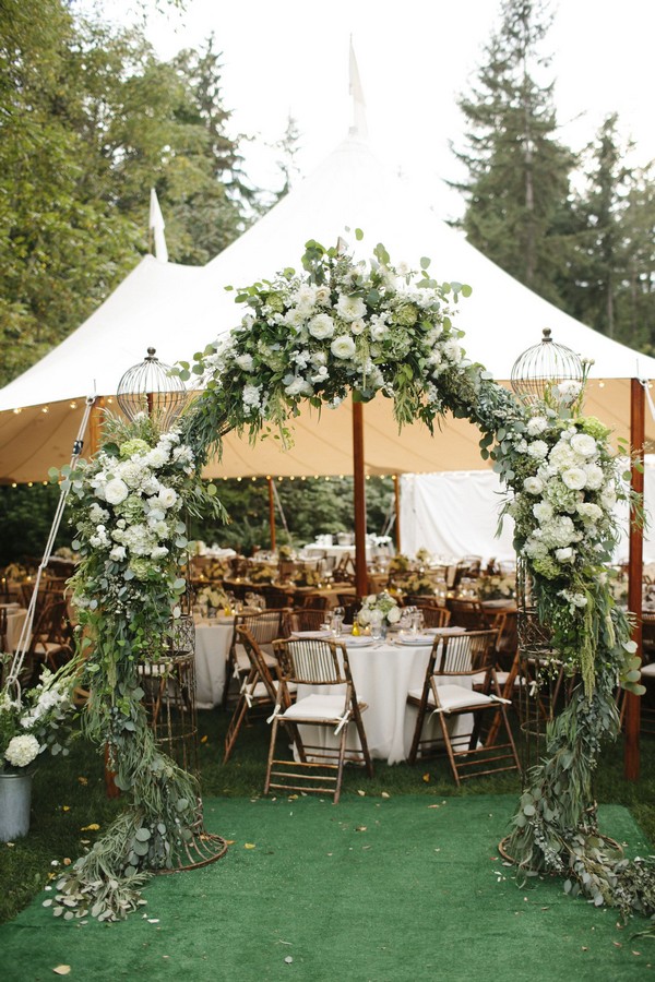 greenery outdoor tented wedding entrance